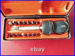 Snap on black stubby ratcheting screwdriver in box with bits